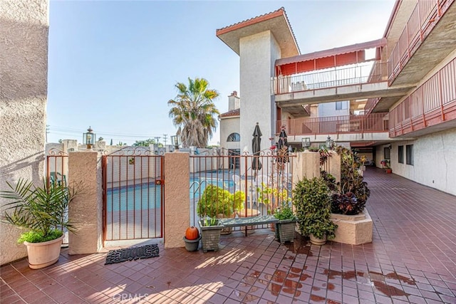 view of patio featuring a community pool