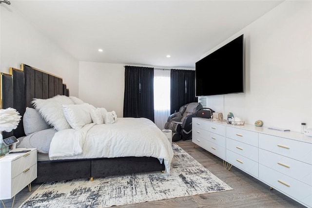 bedroom with dark hardwood / wood-style floors