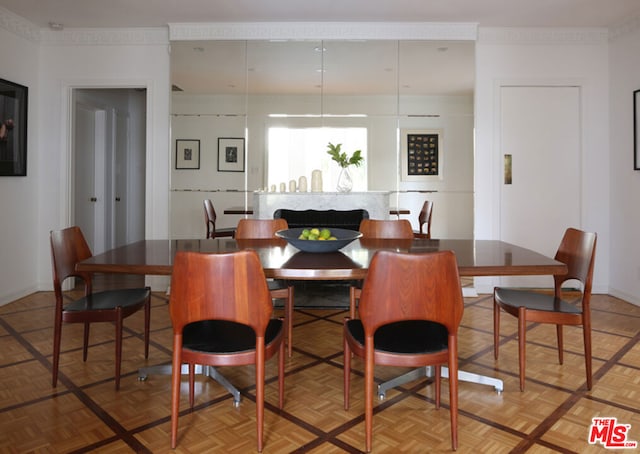 dining room featuring parquet floors