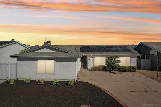 view of front of house featuring solar panels