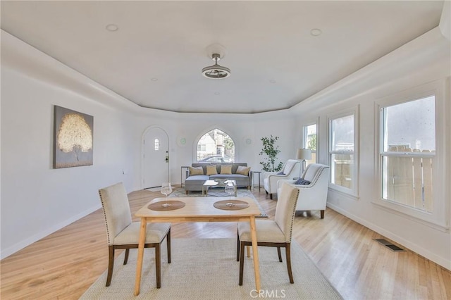 dining space with light hardwood / wood-style flooring