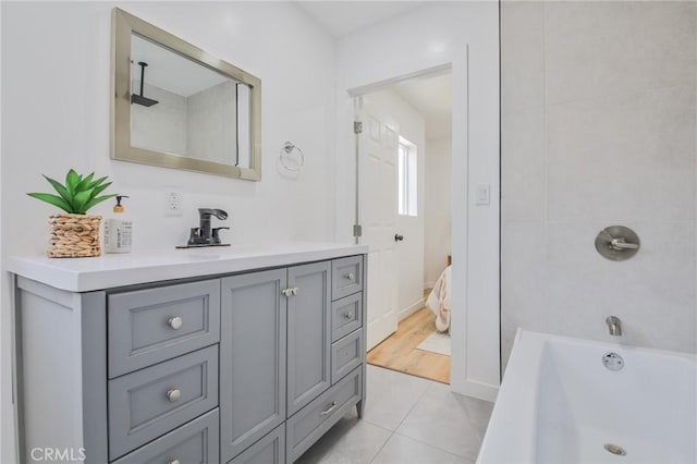 bathroom featuring shower / washtub combination, vanity, and tile patterned floors