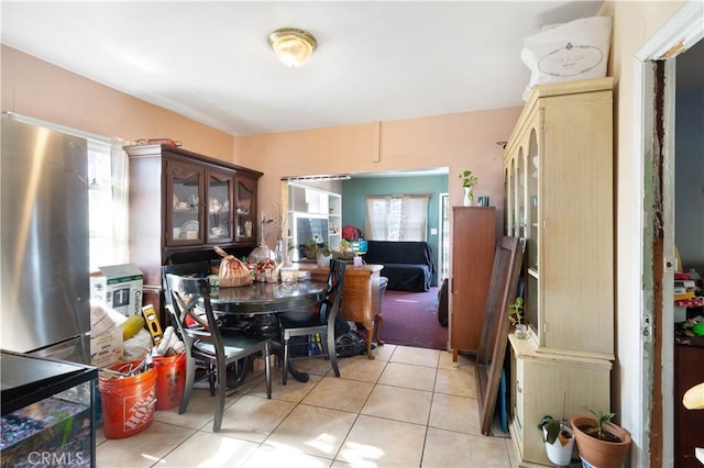 dining space with light tile patterned floors