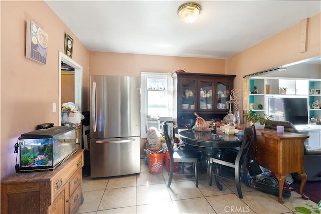 dining area featuring light tile patterned floors