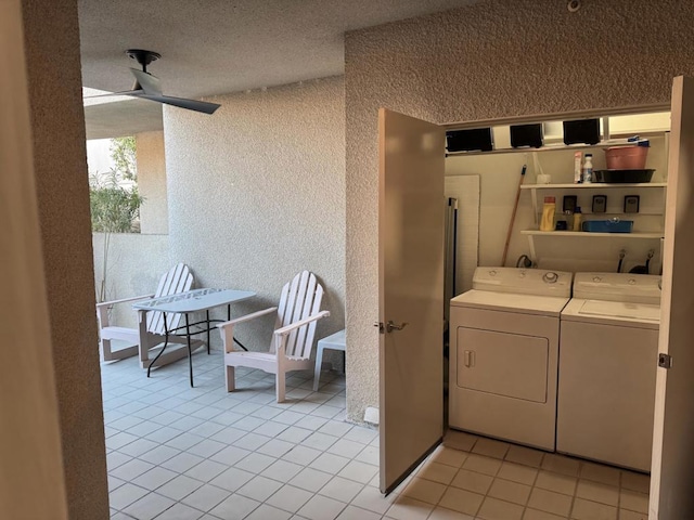 washroom featuring ceiling fan, light tile patterned floors, and washer and clothes dryer