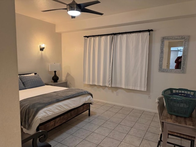 bedroom with ceiling fan and light tile patterned floors