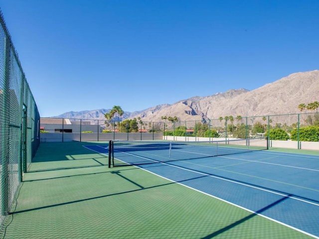 view of sport court with basketball court and a mountain view