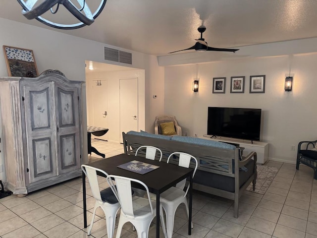 dining room with light tile patterned flooring and ceiling fan