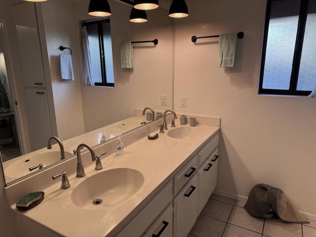 bathroom featuring vanity, tile patterned flooring, and plenty of natural light