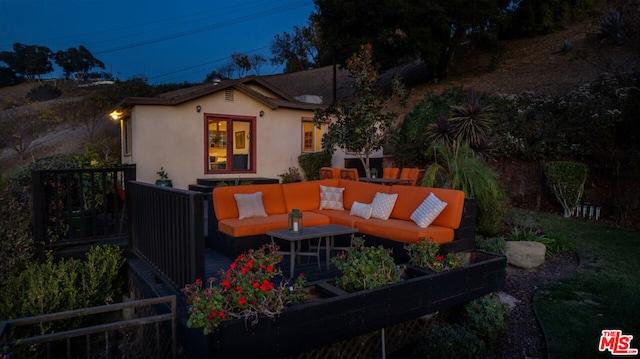 back of property with an outdoor hangout area