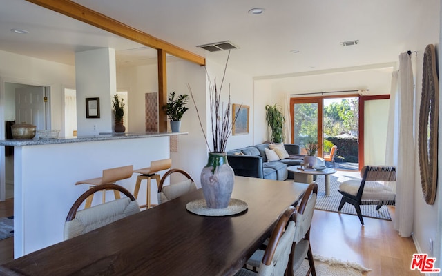 dining space featuring light hardwood / wood-style floors