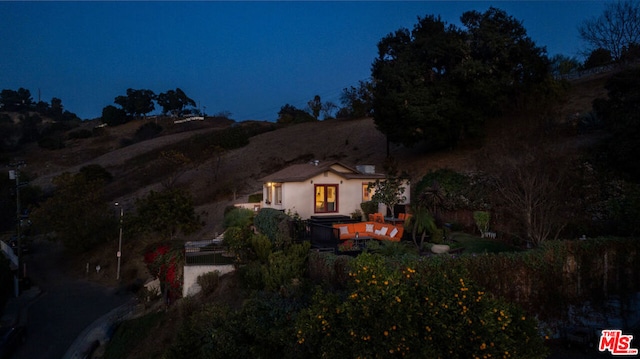 view of back house at night