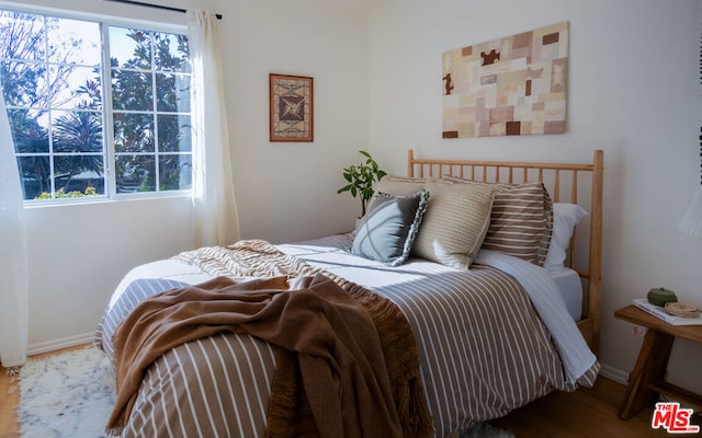 bedroom featuring hardwood / wood-style flooring