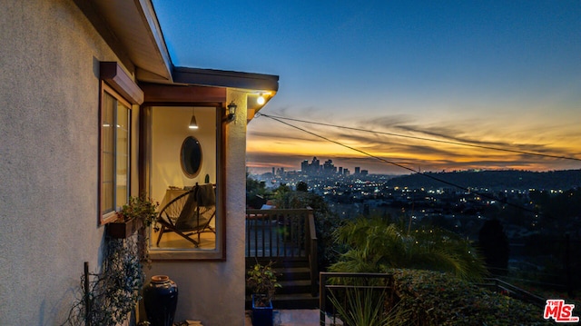 view of balcony at dusk