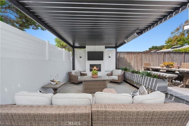 view of patio / terrace featuring an outdoor living space with a fireplace