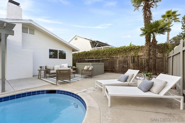 view of pool with a patio and outdoor lounge area