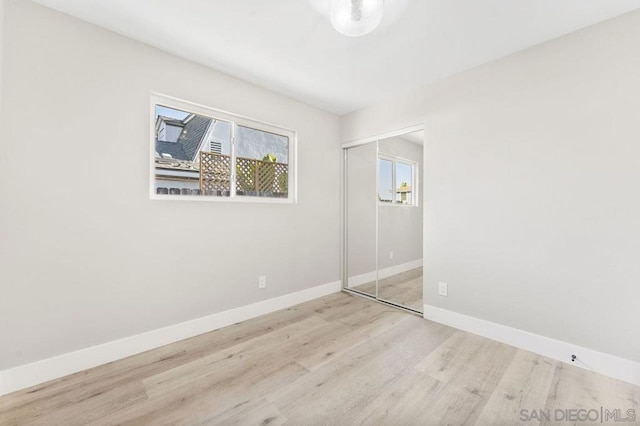 unfurnished room with light hardwood / wood-style flooring