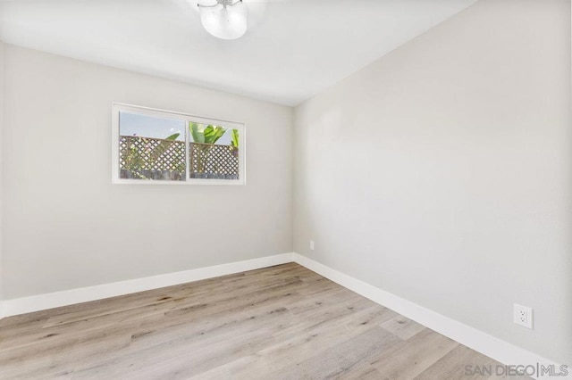 spare room featuring light hardwood / wood-style floors