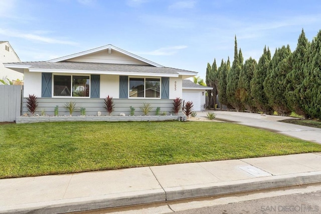 view of front facade with a front lawn and a garage