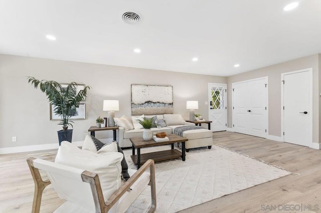 living room with light hardwood / wood-style flooring