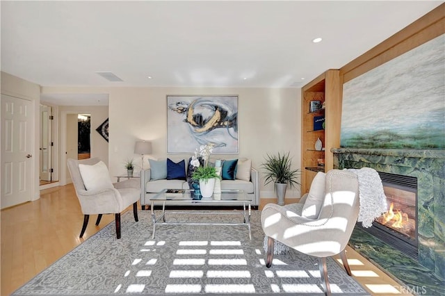 living room with light hardwood / wood-style flooring