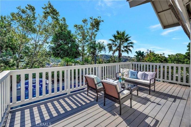 wooden terrace featuring an outdoor hangout area