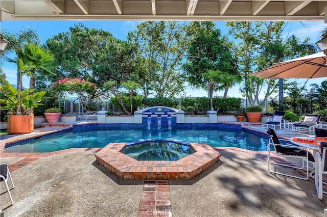 view of pool with an in ground hot tub and a patio