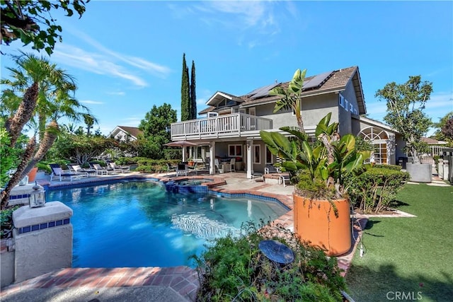 view of swimming pool with an in ground hot tub, a patio area, and a lawn