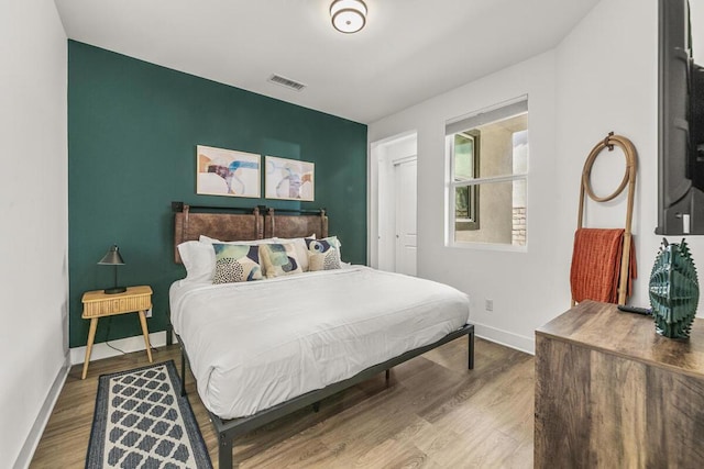 bedroom featuring a closet and hardwood / wood-style flooring