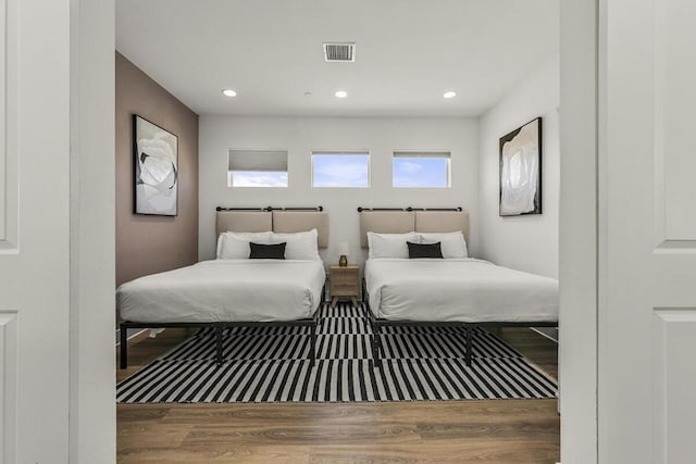 bedroom with wood-type flooring