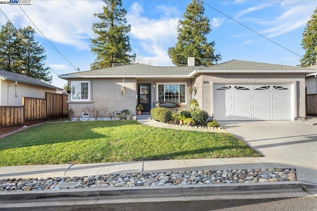 ranch-style home with a front yard and a garage