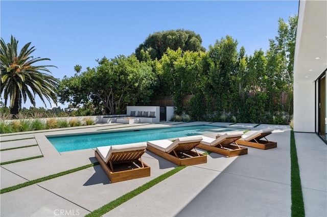 view of swimming pool with a patio