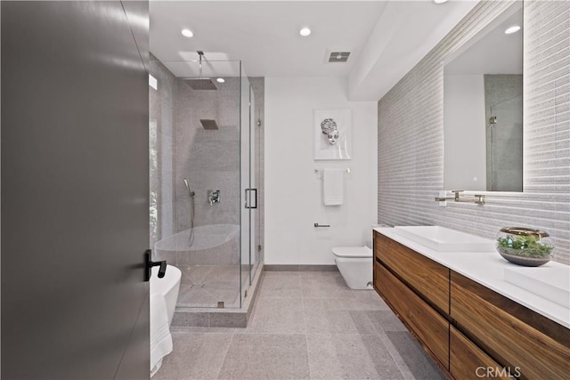 bathroom with walk in shower, vanity, and toilet