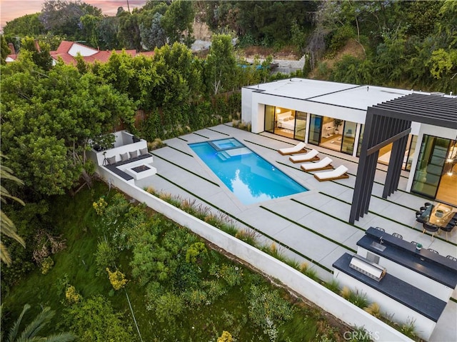 view of swimming pool featuring a patio