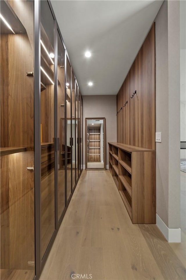 hallway with light wood-type flooring