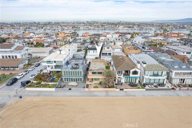 bird's eye view with a water view and a residential view