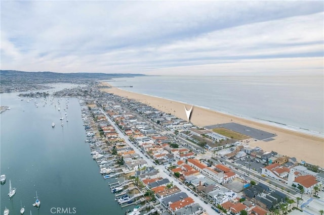 drone / aerial view with a view of the beach and a water view