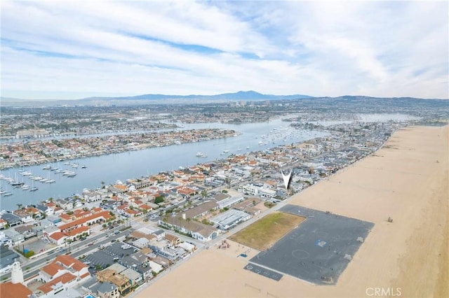 exterior space featuring a water and mountain view