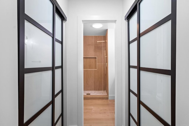 hallway featuring wood-type flooring