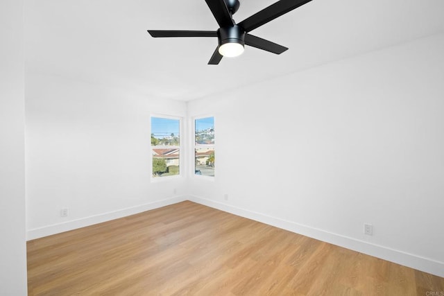 spare room featuring ceiling fan and light hardwood / wood-style flooring