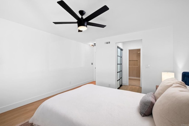 bedroom with light wood-type flooring and ceiling fan