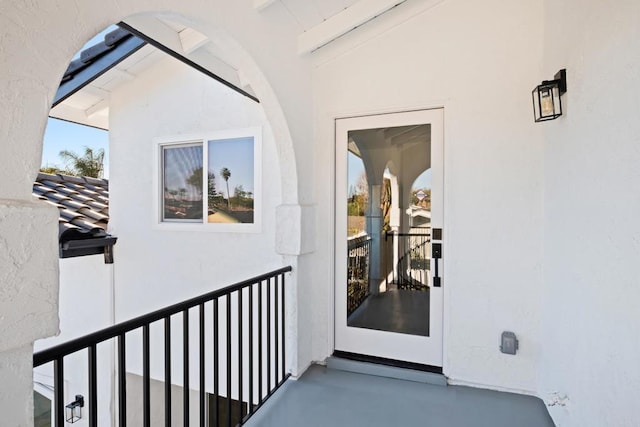 doorway to property featuring a balcony