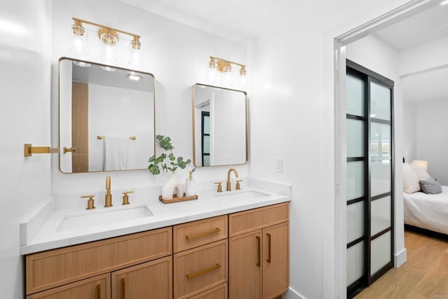 bathroom featuring vanity and hardwood / wood-style flooring