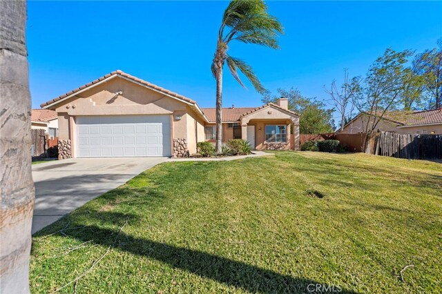 ranch-style home featuring a front lawn and a garage