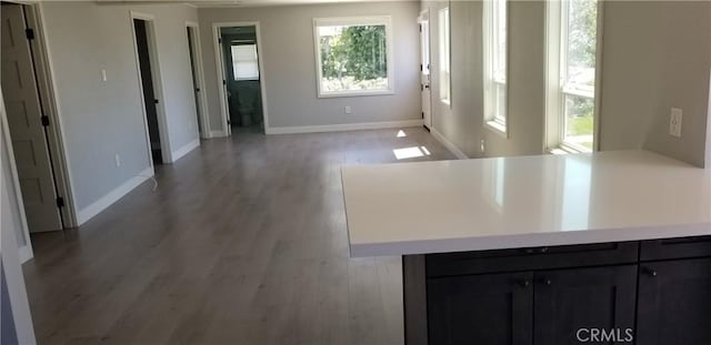 interior space with light hardwood / wood-style floors and kitchen peninsula