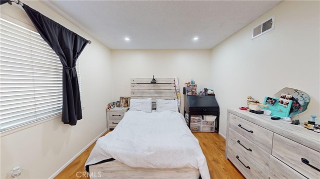 bedroom featuring light hardwood / wood-style flooring