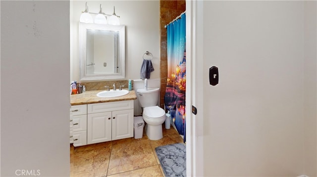 bathroom with toilet and vanity