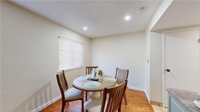 dining space featuring light wood-type flooring