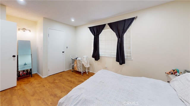 bedroom featuring light hardwood / wood-style floors