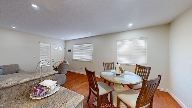 dining area with hardwood / wood-style flooring